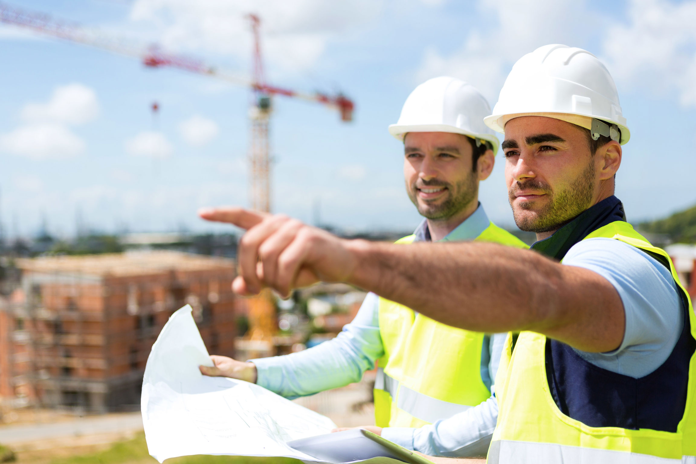 Resized-Worker and architect watching some details on a construction